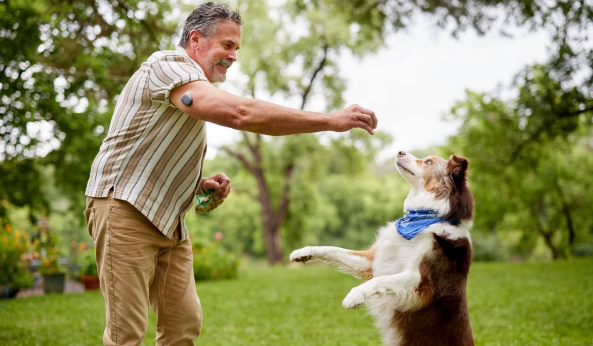 Diabetic Man Playing with Dog